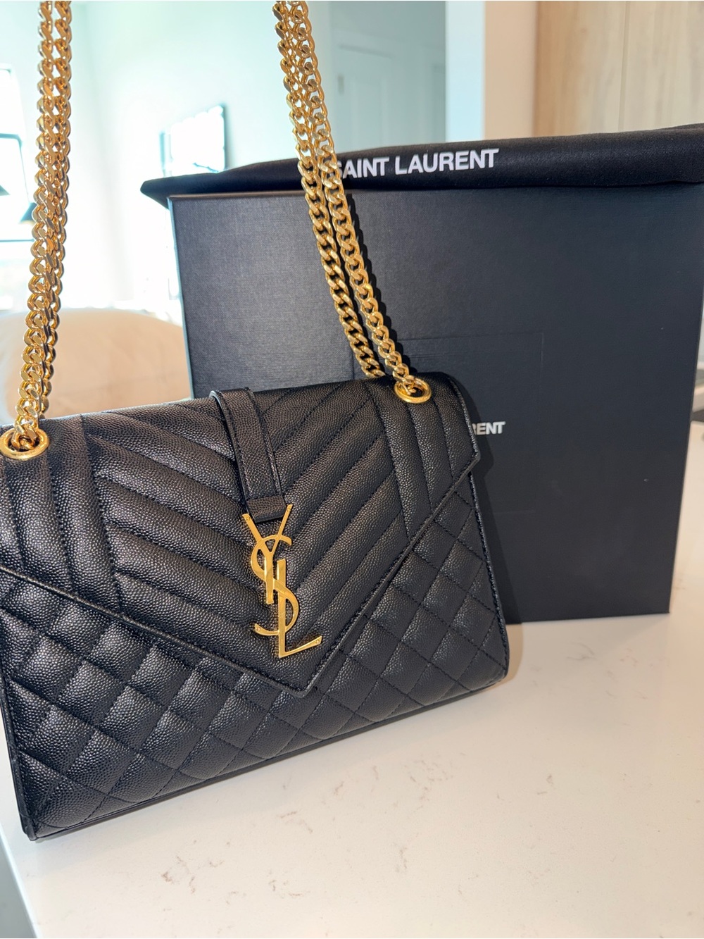 AUTHENTIC YSL Envelope Triquilt Medium Shoulder Bag in Black Grained Leather.